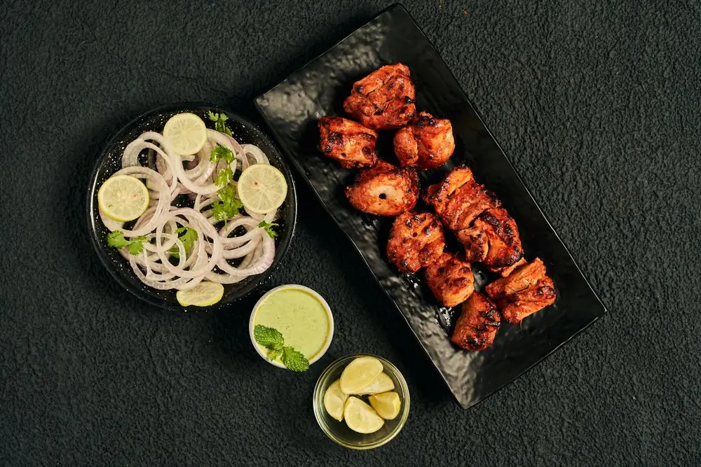 Tandoori chicken starter with onion salad and mint chutney